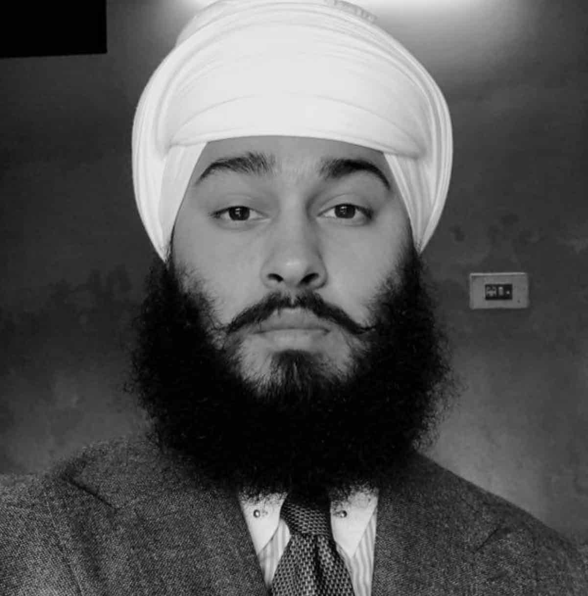 a man wearing a turban with a beard